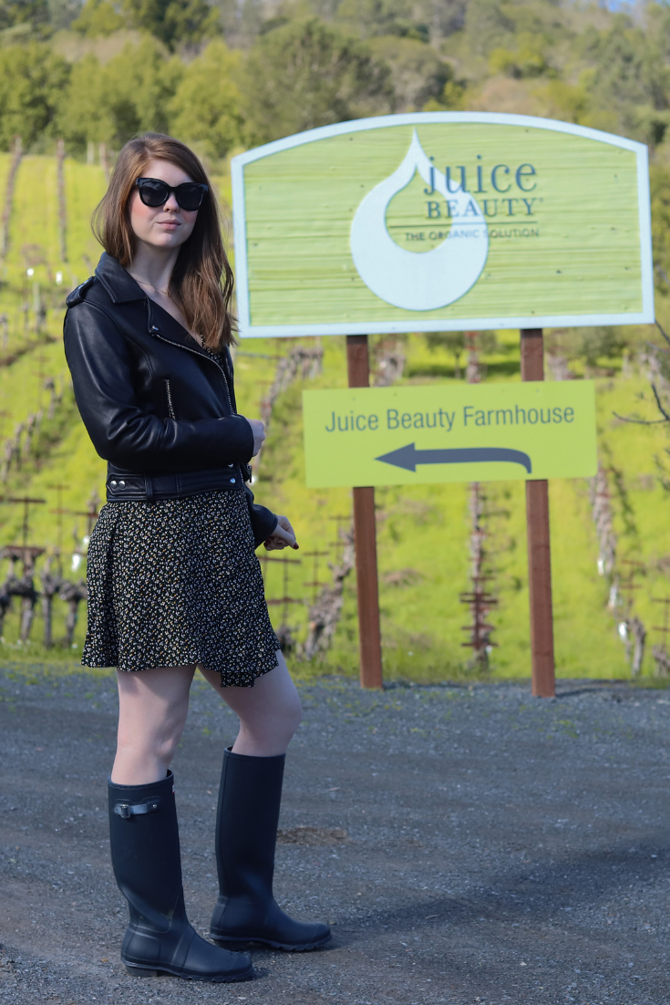 juice beauty, farm, sonoma, healdsburg, clean beauty, nontoxic beauty, skincare, green, madewell button wrap dress playground posies, blanknyc leather jacket, tall hunter rain boots, black oversized sunglasses