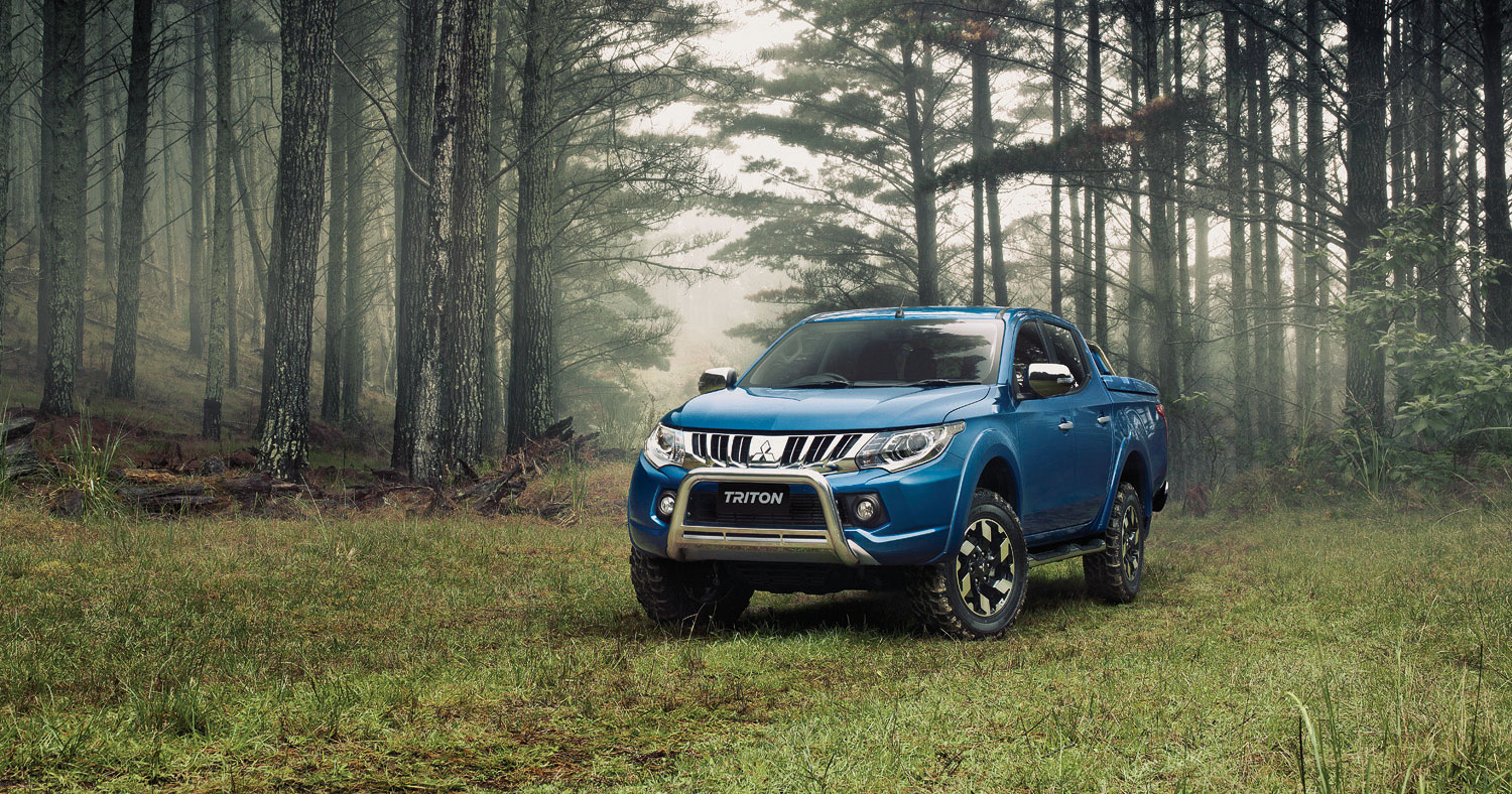 Mitsubishi Triton in a foggy forest