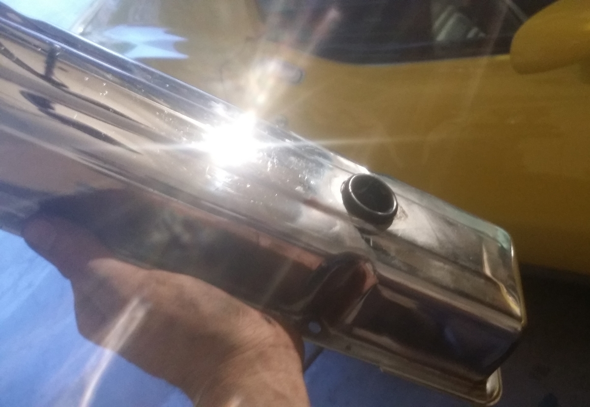 Even the best chrome polish (right) leaves a little haze behind that only a buffer can fix (left).
