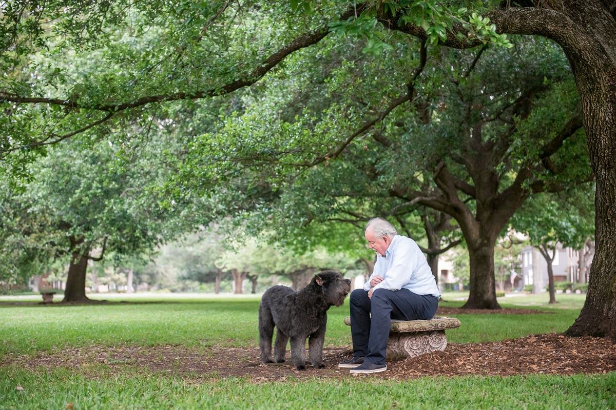 older man with dog in houston river oaks park