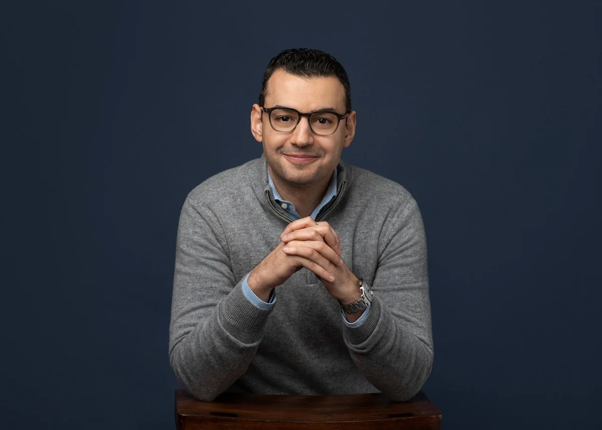 headshot of Houston professional wearing glasses