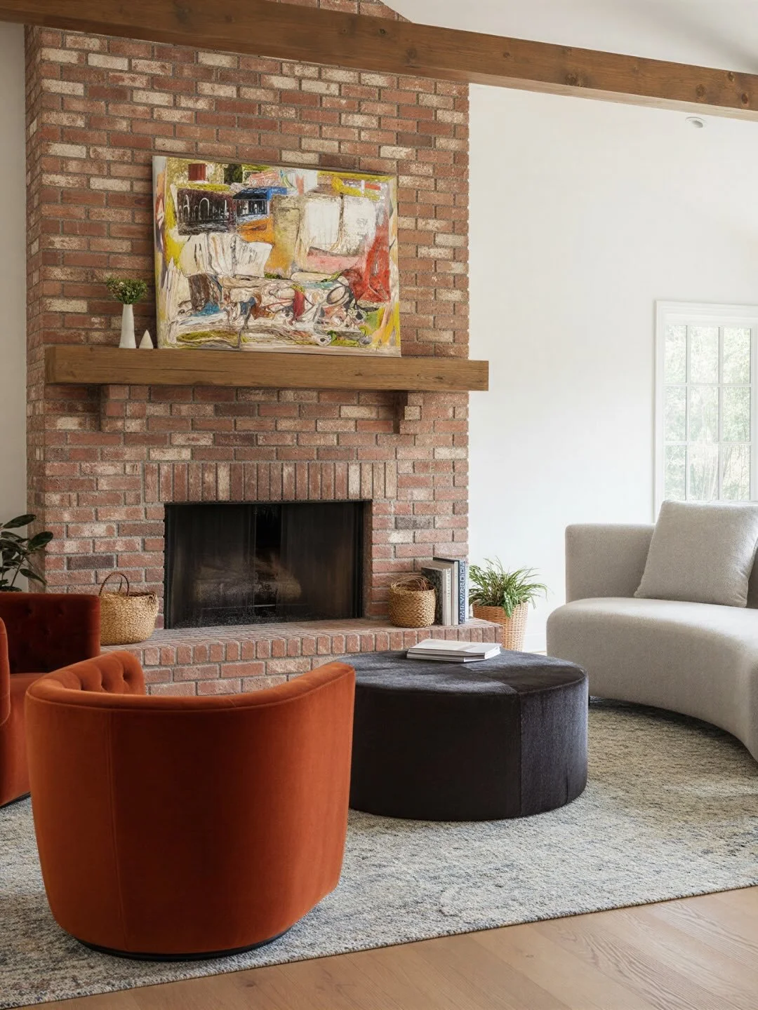 Not every room needs to be the loudest voice in the house.

In this family room, our goal was to create a space that felt calm, grounded, and effortlessly inviting. Located just off the kitchen and connected to several other living spaces, this room 