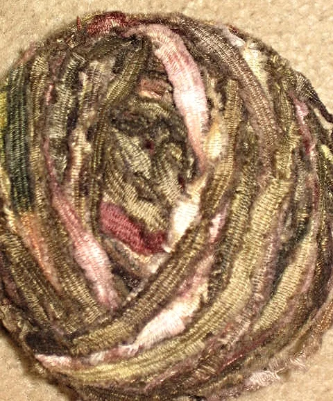  An old shawl I found at a resale shop, took it apart and rolled up...what perfect colors! 