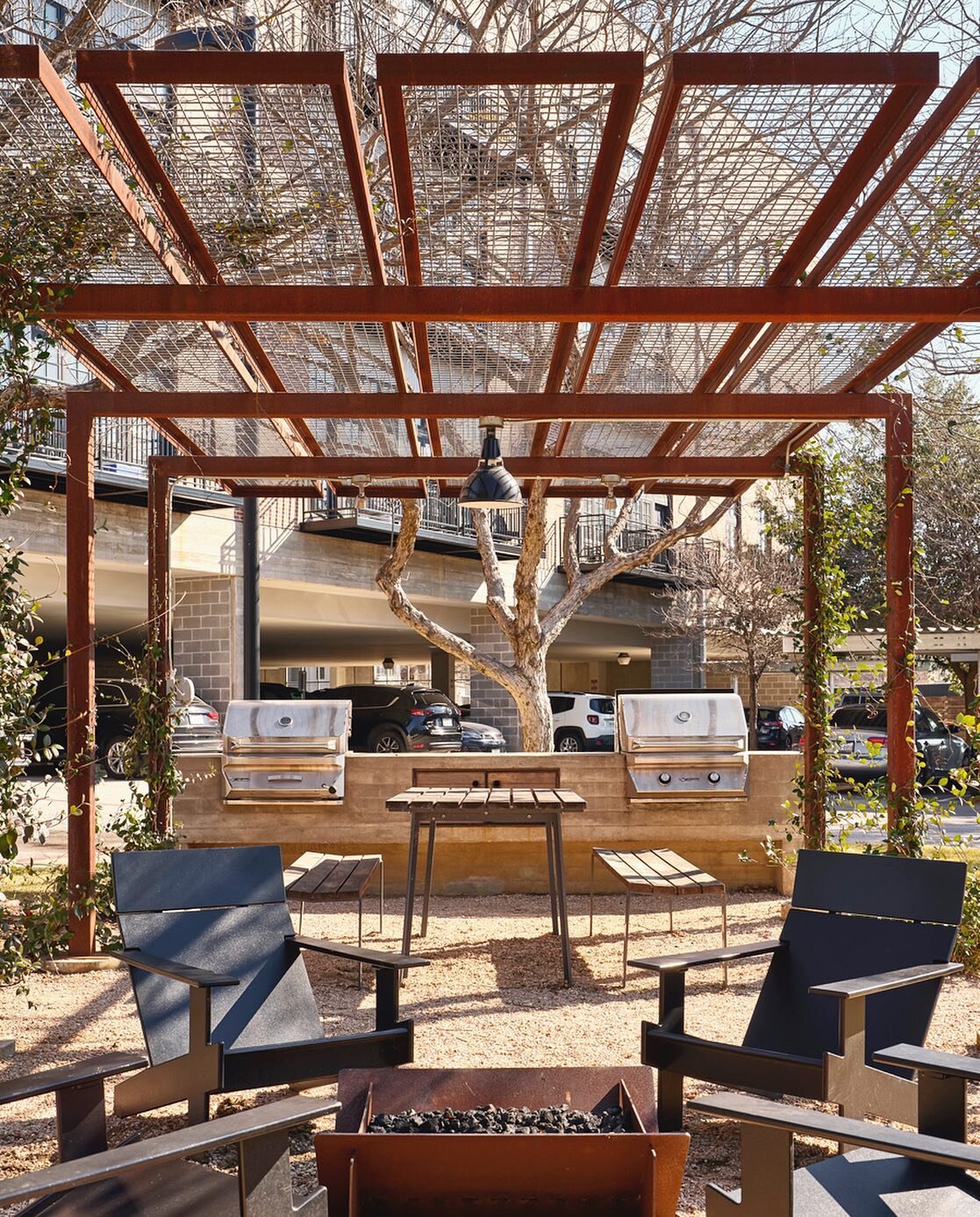 Entering the time of year in Austin where shade makes a BIG difference and thinking about this shade structure/ communal BBQ/ hangout area we designed for Este Lofts pre-Covid&hellip;that we finally had photographed! The fire pit comes in handy for t