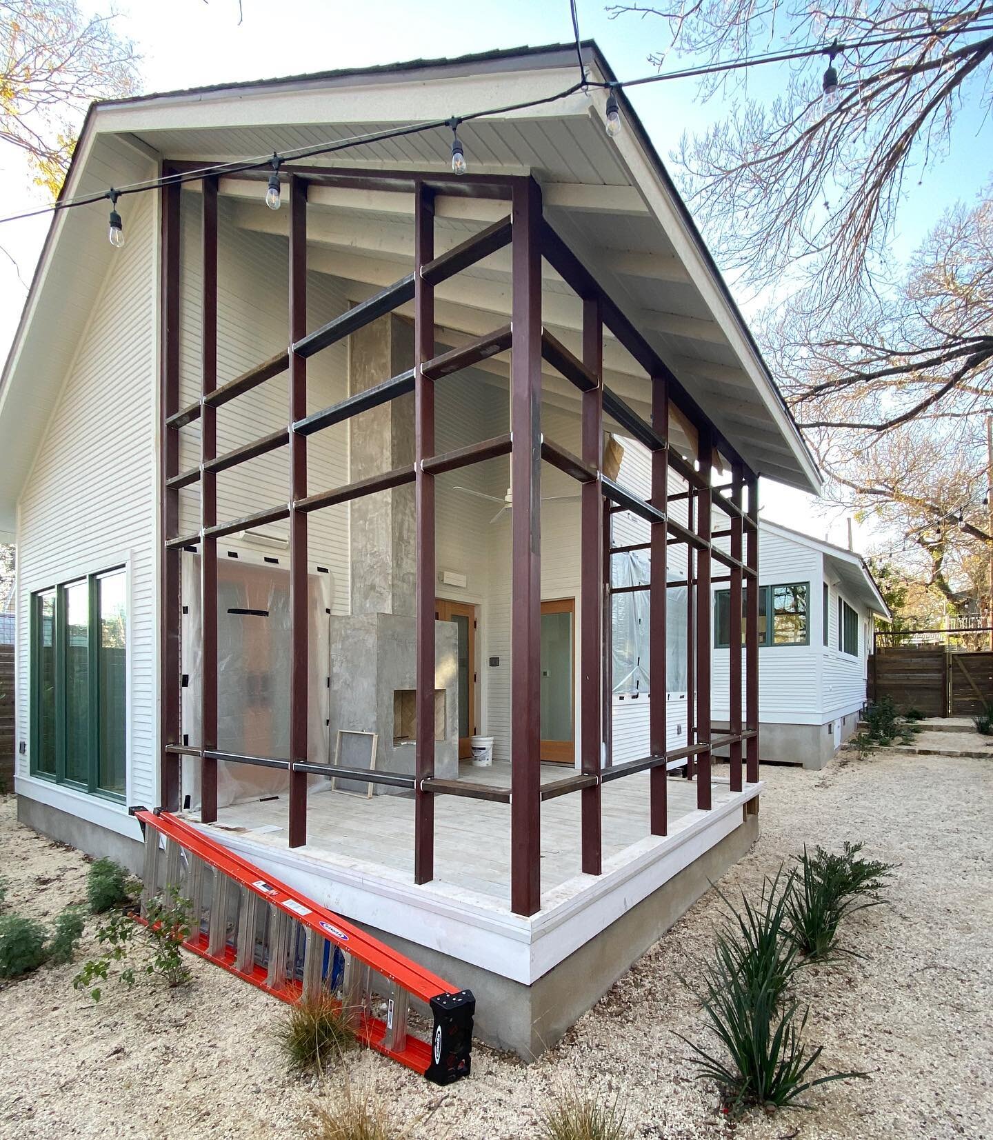 Another recent in progress pic, this one of the #shelleyaveproj remodel/addition and its small but mighty screened porch (shown here before paint, screens, etc.).This spot is perfect for year round hangouts in Austin thanks to the outdoor fireplace! 