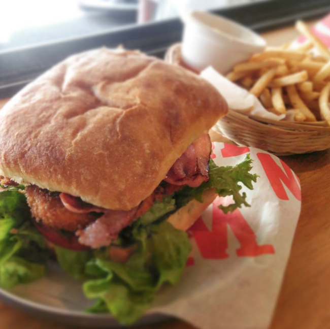 The Flying Beast burger from The Wagon - chicken fillet with a crunchy coating, bacon, tomato, lettuce, relish and aoli on and artisan bun.