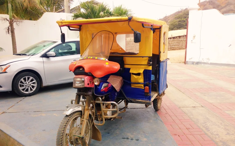 The mototaxi, the preferred mode of transport by locals. It is essentially a motorbike with covered bench seating good for three. It is cheap, just 1.5 soles into town, or 2 soles if further.