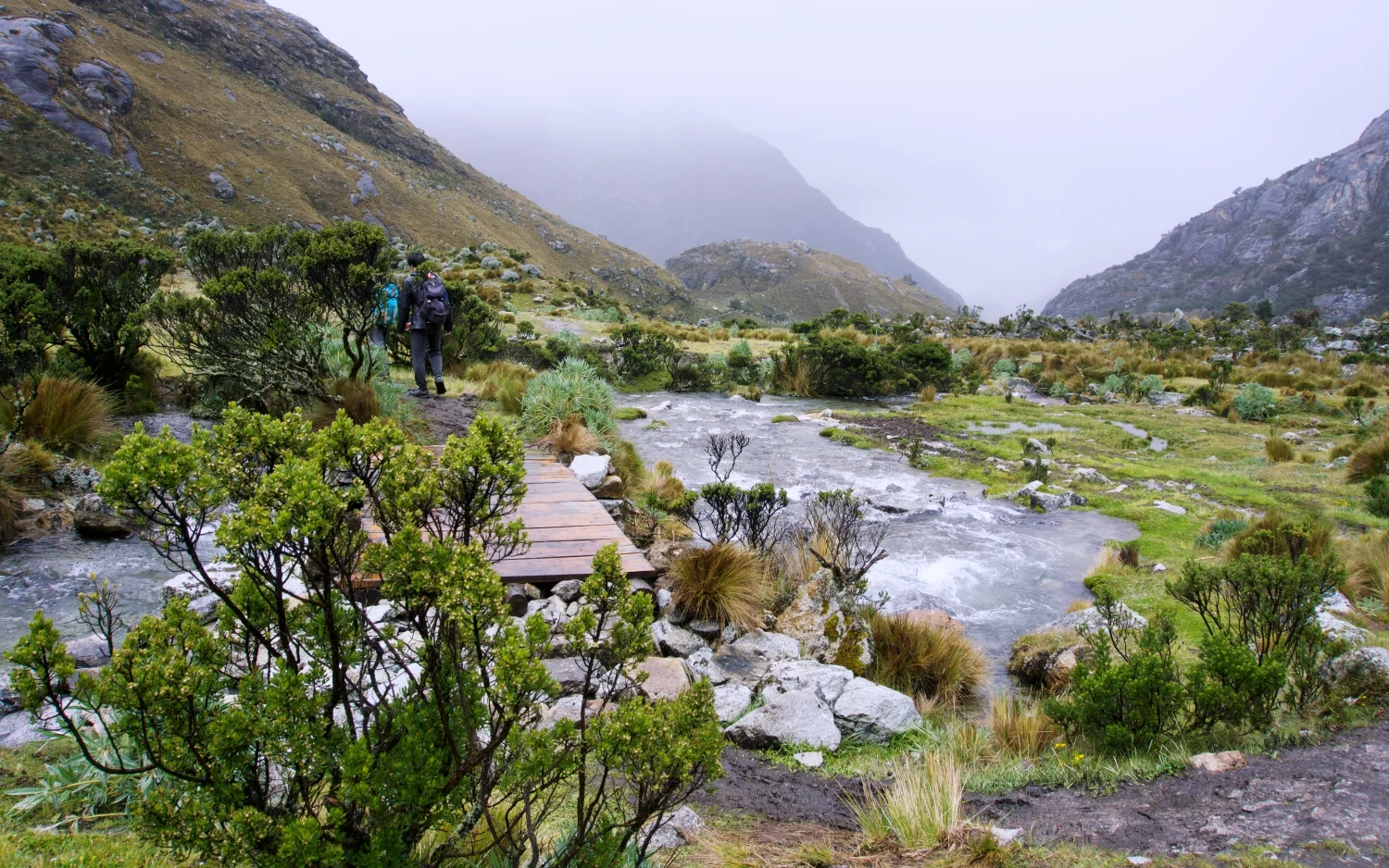 We had plenty of mud and stream crossings with these wooden bridges. It can be four seasons in one day, so make sure to pack a rain jacket or poncho.