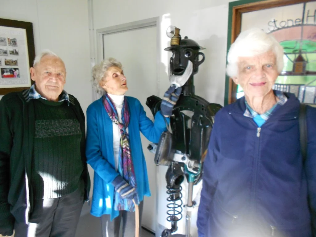 This photo is of Trevor Chapman Phyl Stuart & the Blackball coal miner made from scrap metal/and Pauline Burling