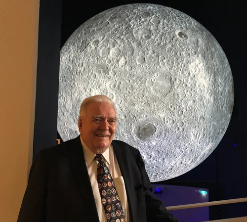 Mike Dinn in front of a 7 metre diameter lunar globe at Questacon science centre in Canberra, 23rd November 2018. Photo by Colin Mackellar.