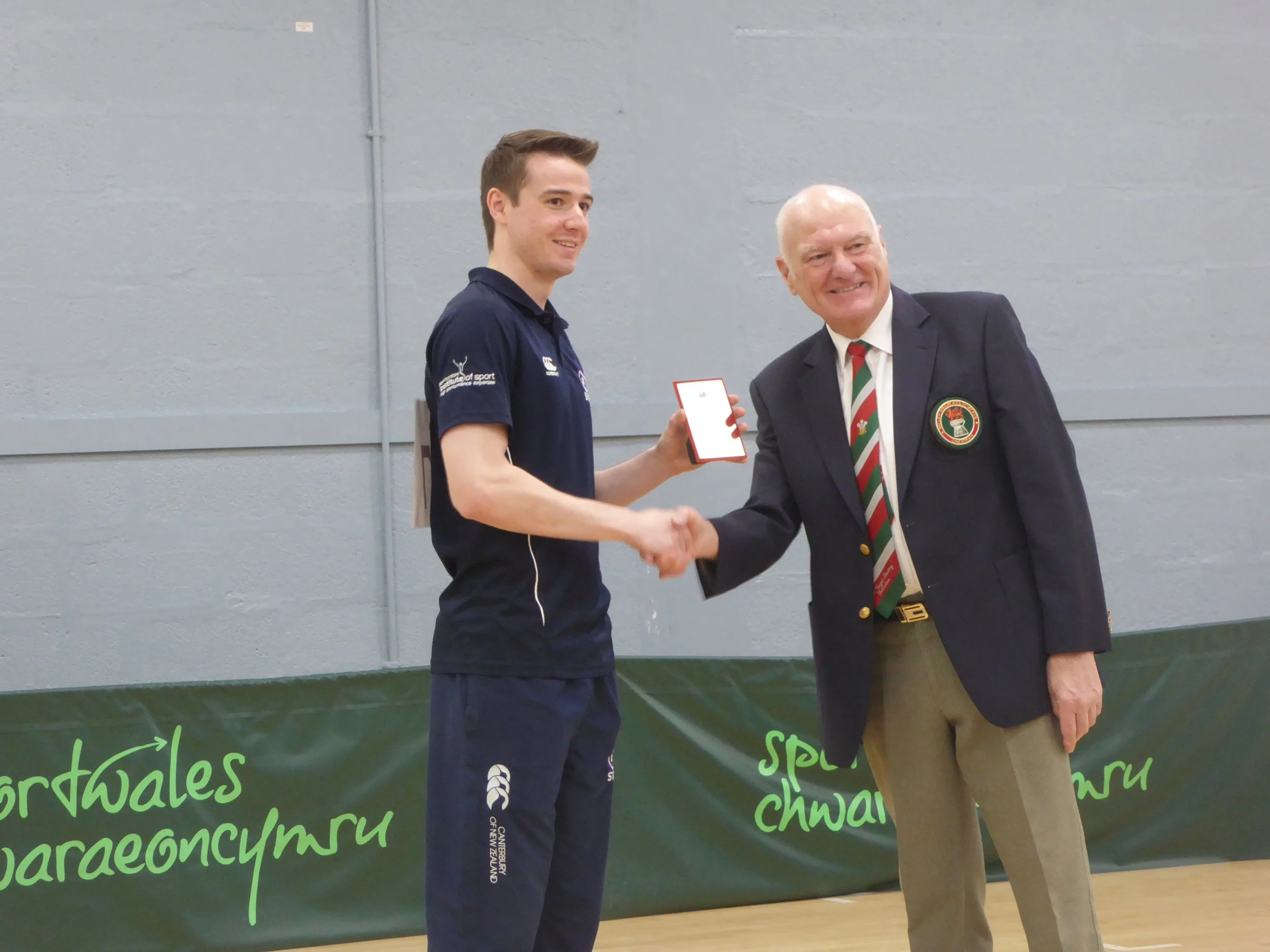 Aedan Evans receiving his Gold medal