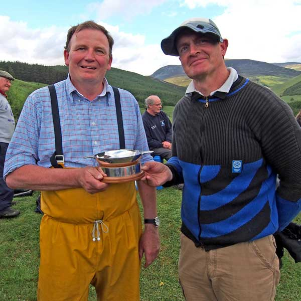 Simon and Angus McLeod (his wind coach) with the David Hossack Memorial Trophy