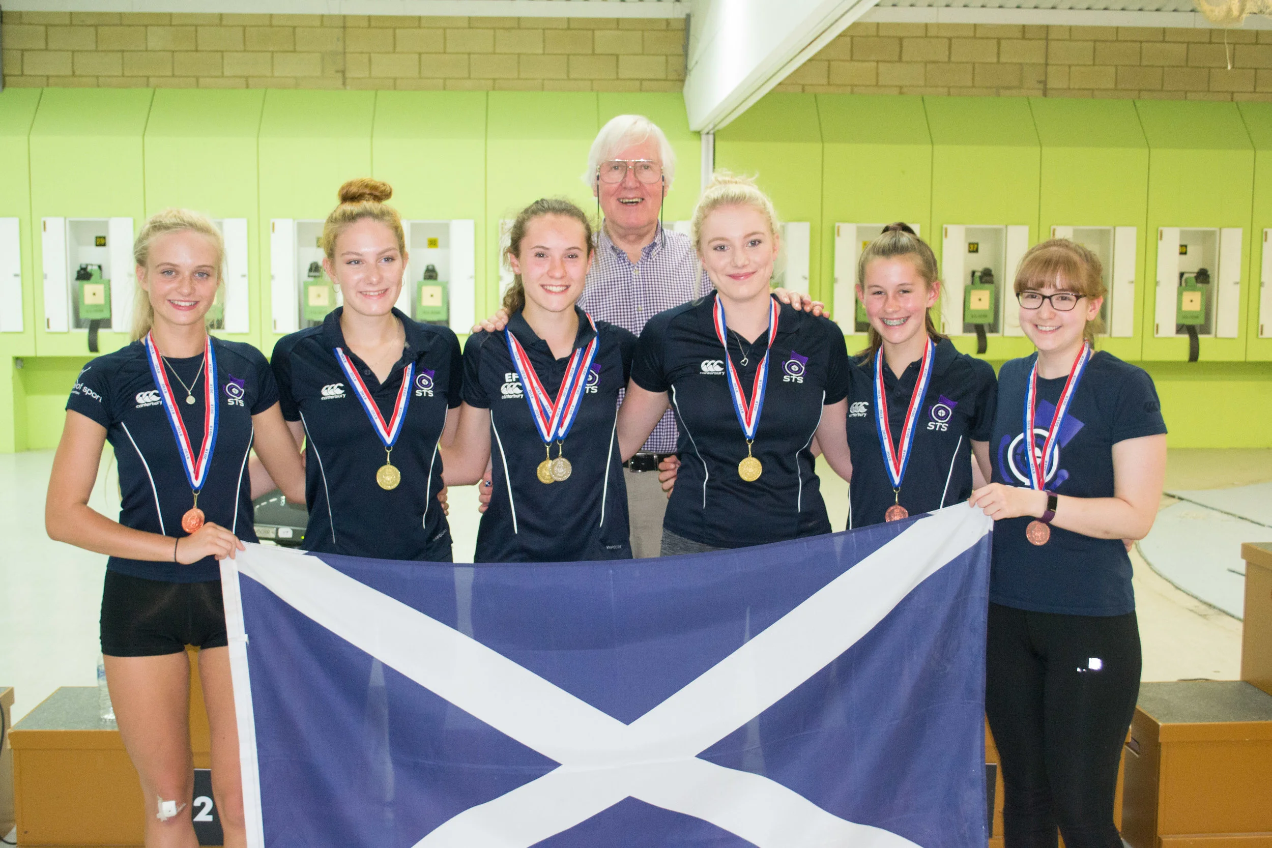 Gold and Bronze Team medallists with coach Hugh Hunter