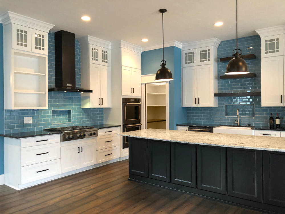 This bright, eye-catching blue tile is a showstopper in this modern kitchen.
