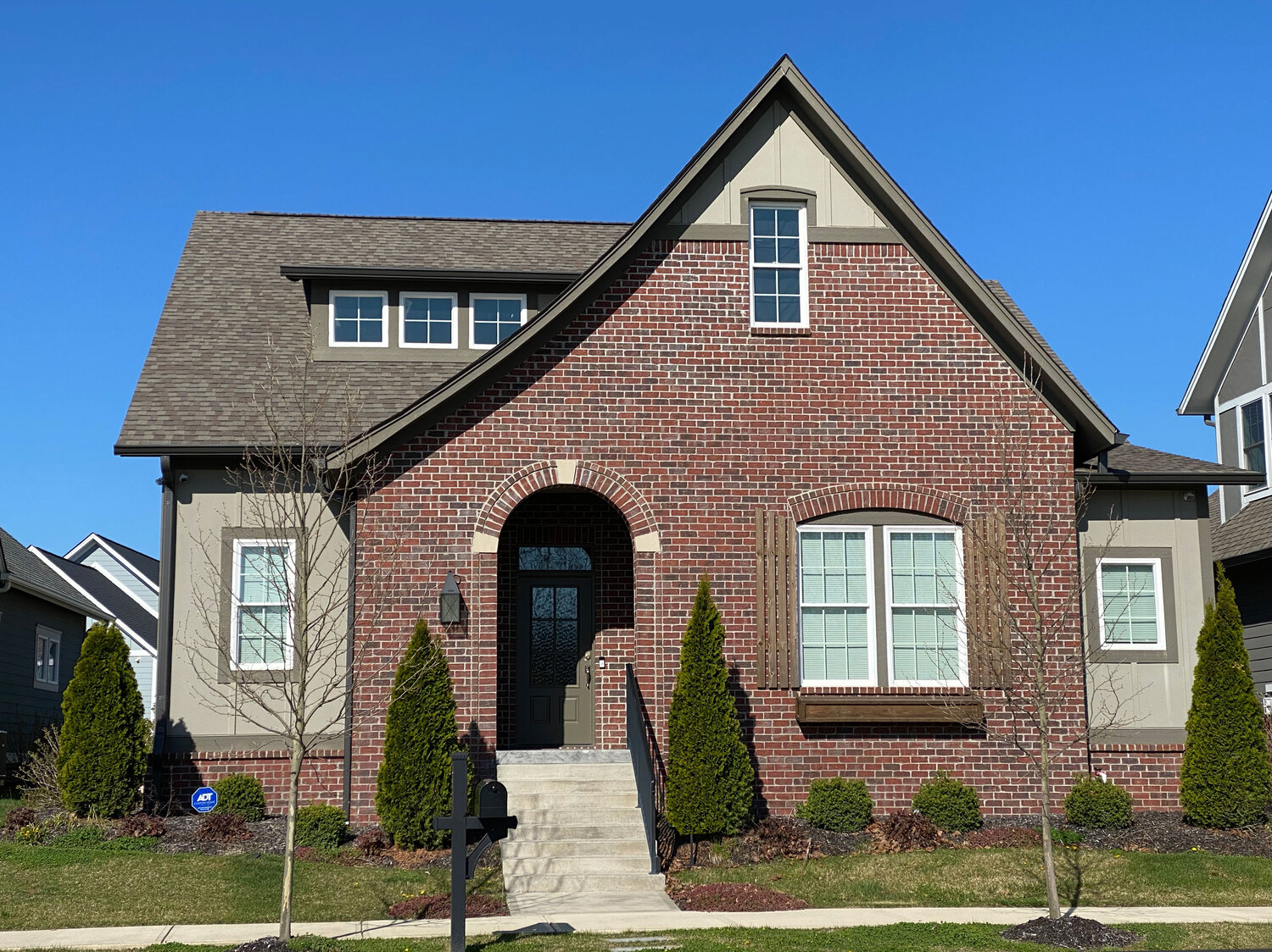 The Tudor style home is known for its steeply pitched roofs and elaborate masonry chimneys.