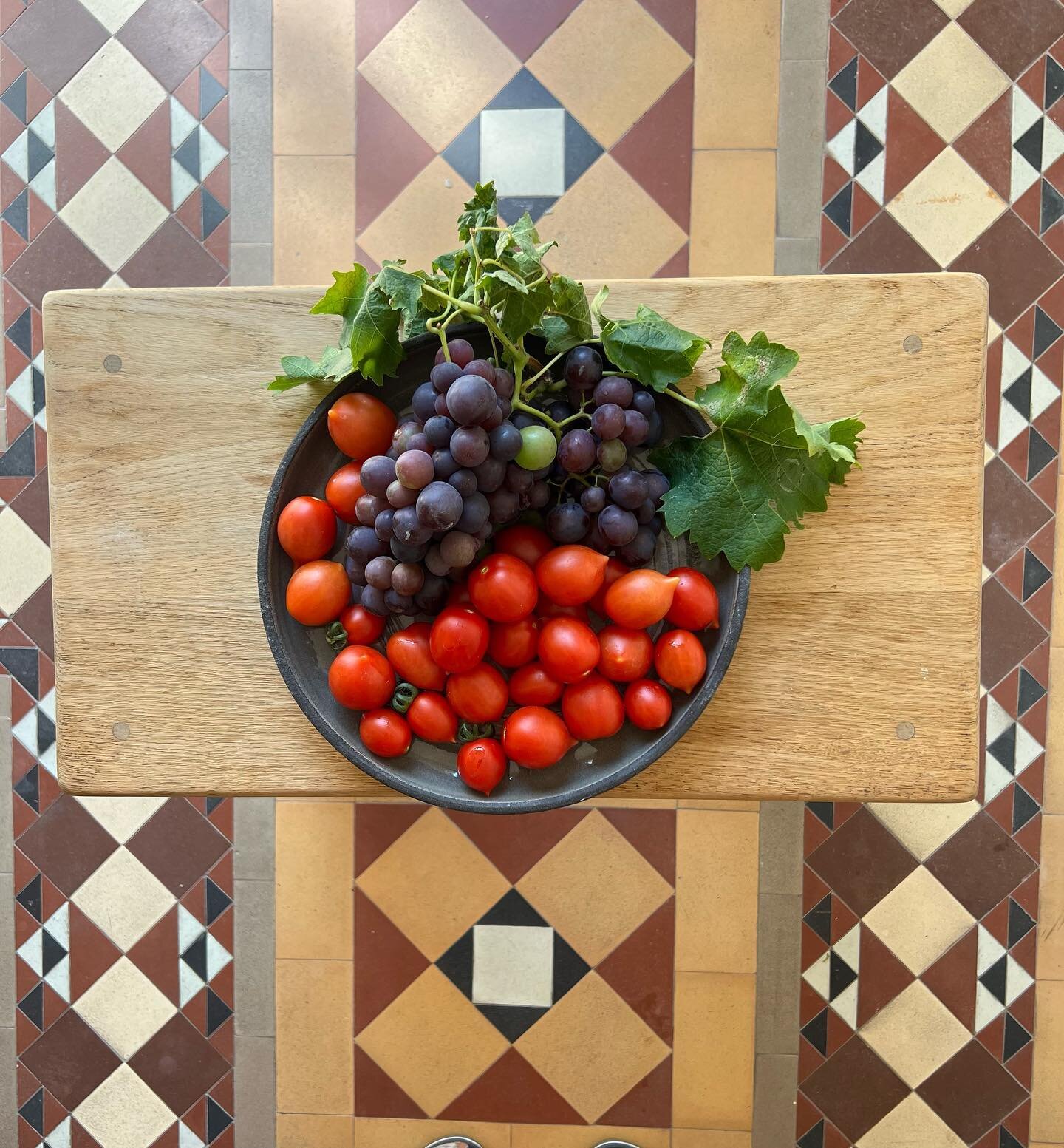 Produce from a friend&rsquo;s garden displayed in the potter&rsquo;s dish #gardenproduce #ceramicdish