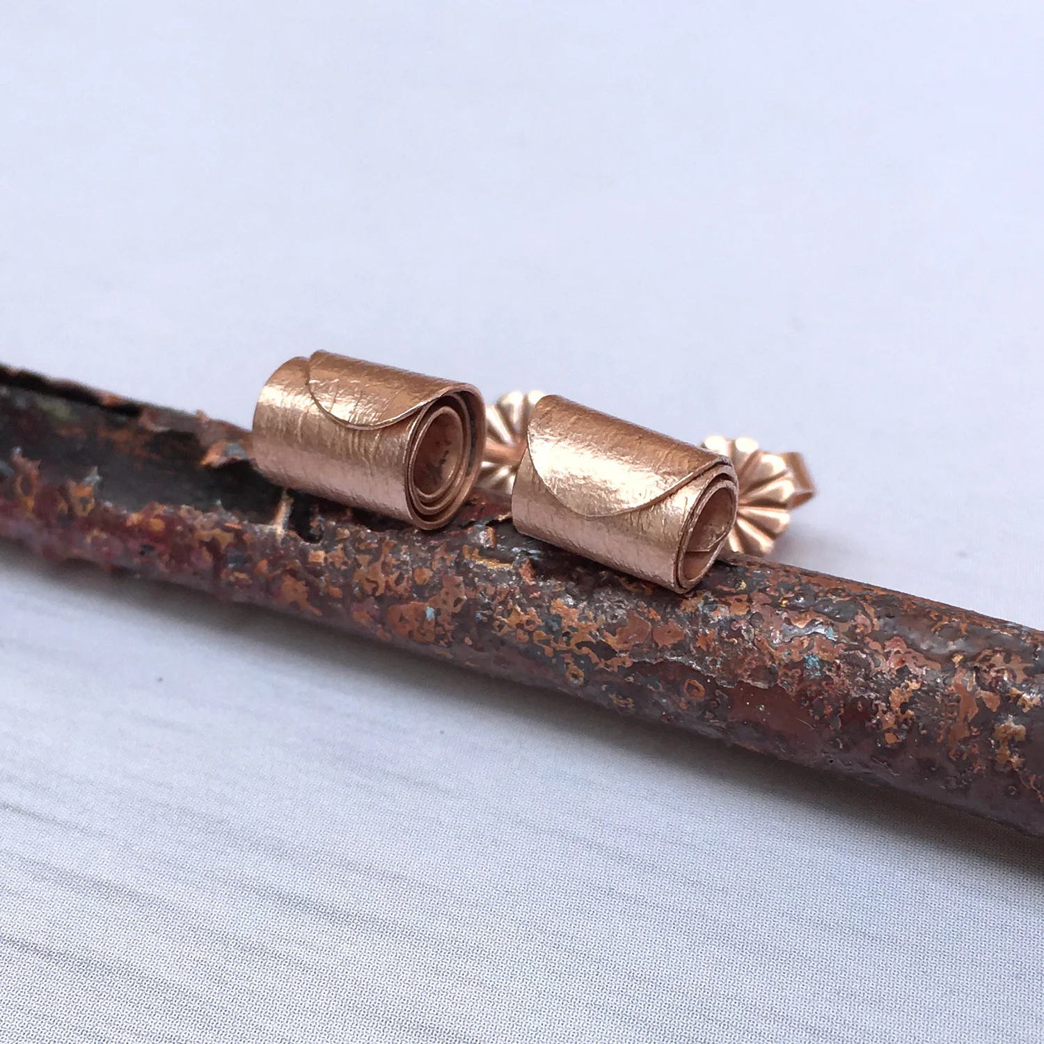 HannahLouiseLamb-rolled-wave-studs-rose-gold-plated.jpg