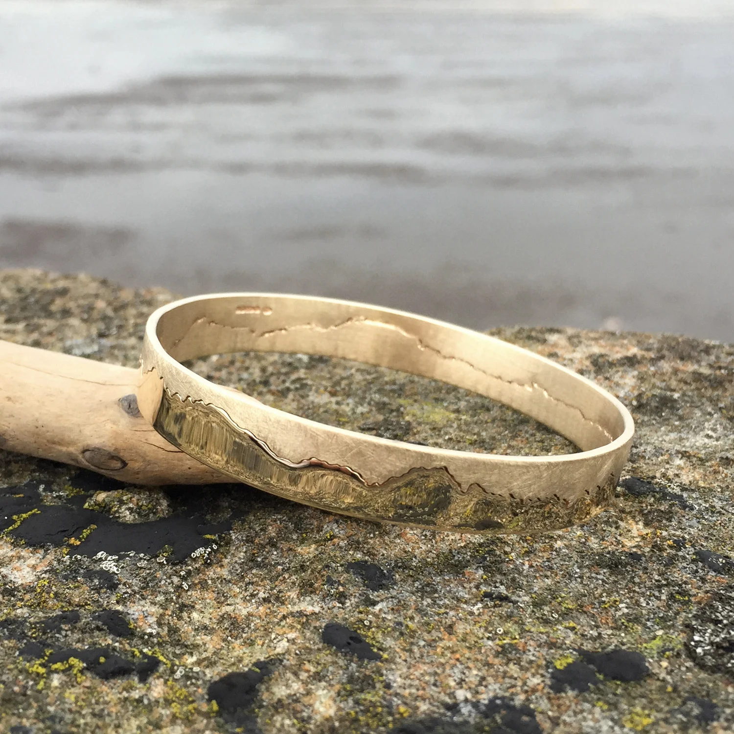 HannahLouiseLamb-gold-bangle-coastline.jpg