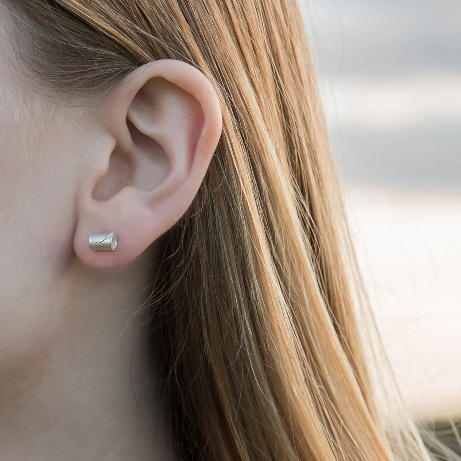 HannahLouiseLamb-rolled-wave-silver-studs.jpg
