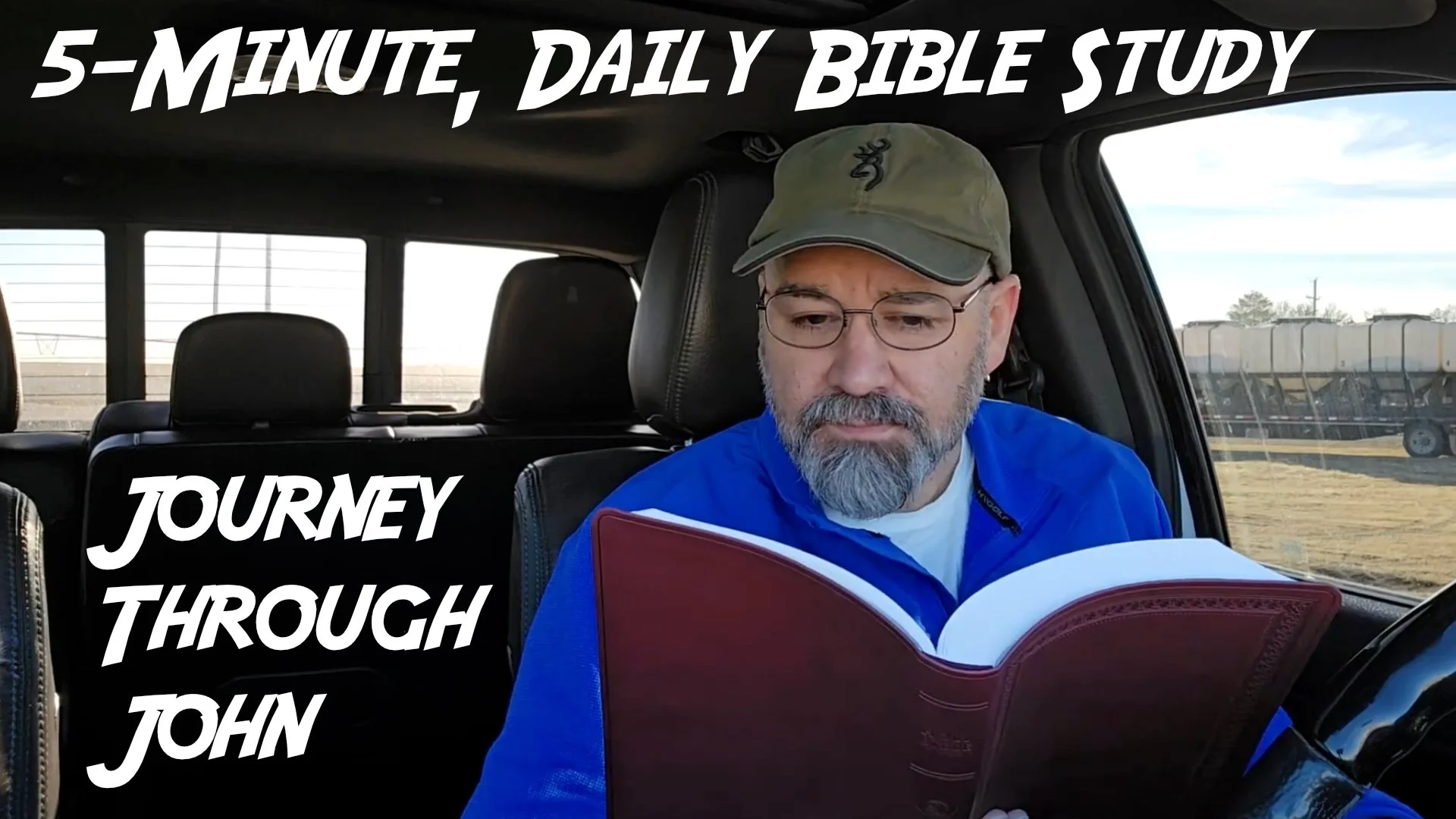 Bryan Catherman reading a Bible in his truck.