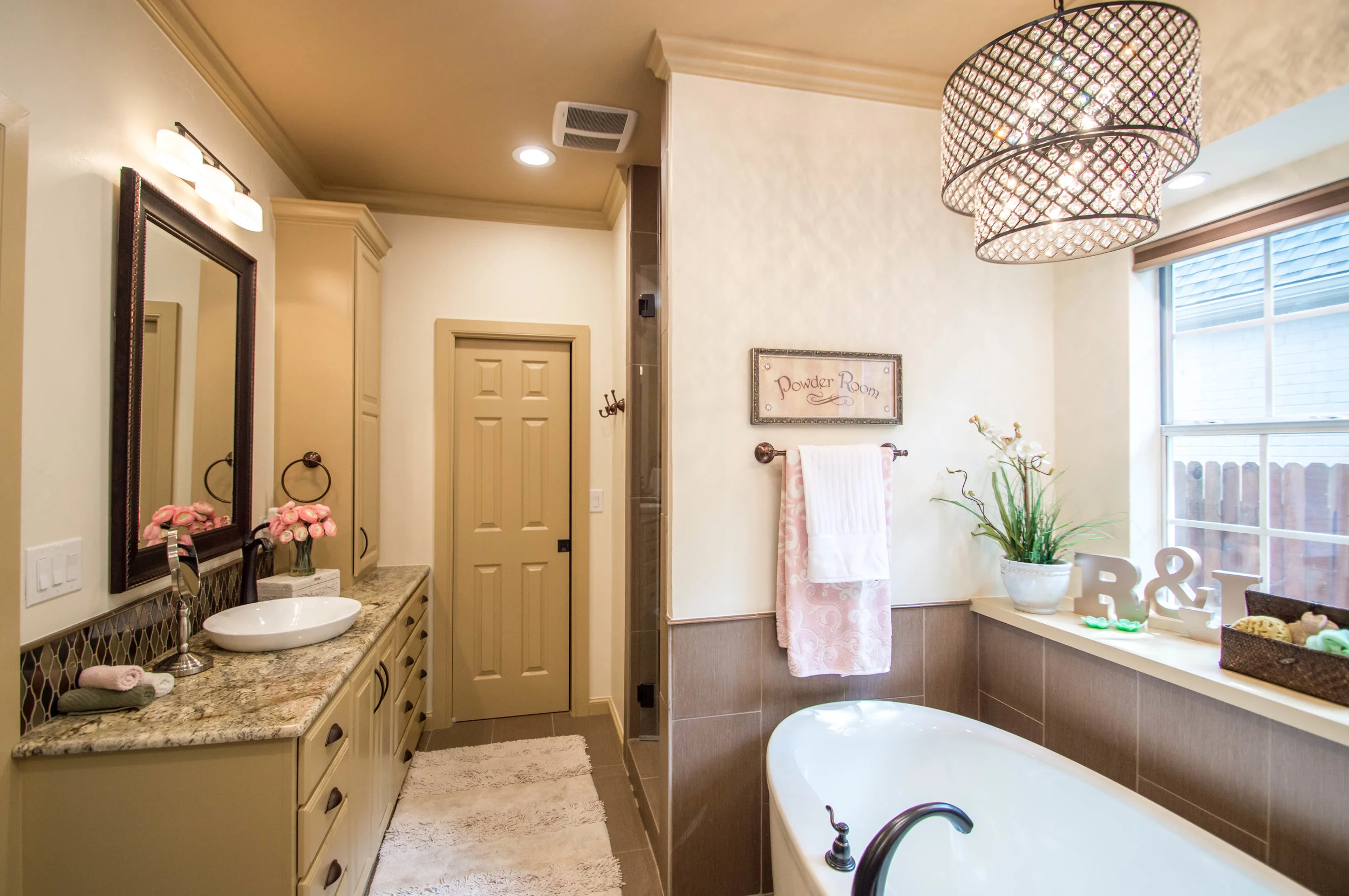 "Amy & Ian Prosser were awesome! We finally decided to remodel after living with an ugly bathroom for ten years. When they came into our home, they were able to work with me by nailing my design and decorating likes and dislikes. During the process, we decided that we were ready to move to a different area of town. In the middle of the project, Amy chose a different design path to help work better with the design style of the majority of buyers in our area. We felt that she chose the design perfectly. Everyone worked very hard and put in many hours to make our experience and home transition perfect." - Jamie + John M.