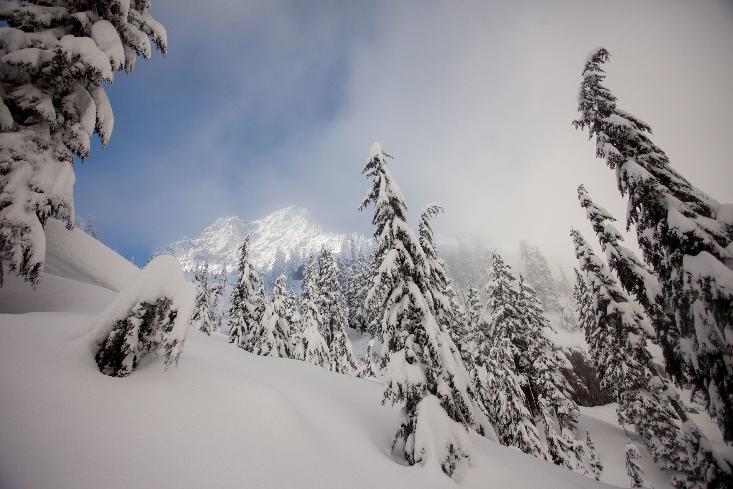 Bryant Peak shines through the clouds