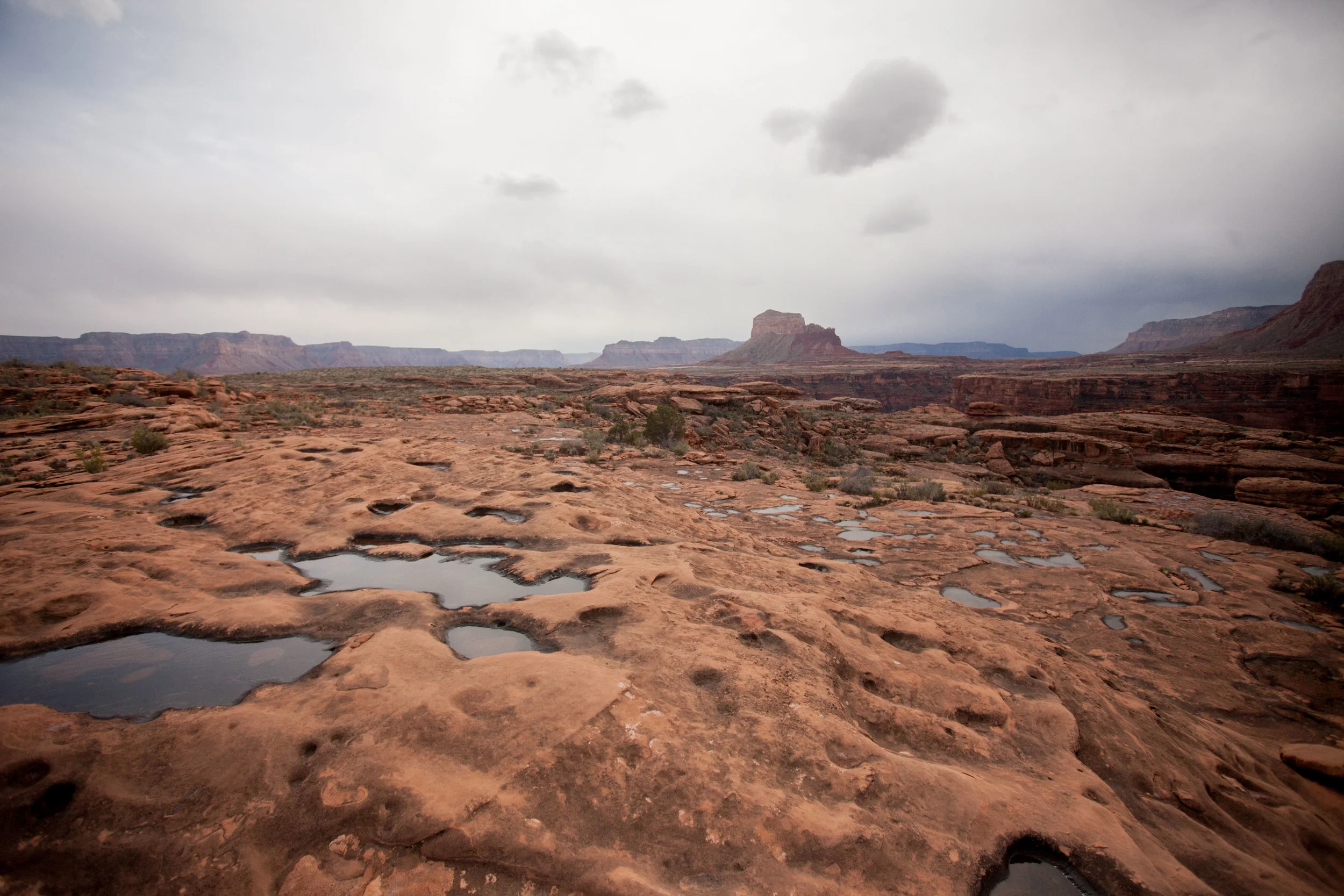 Perched on top of the Esplanade, watching storms roll in as we tried to decide if we should drop into a slot canyon.