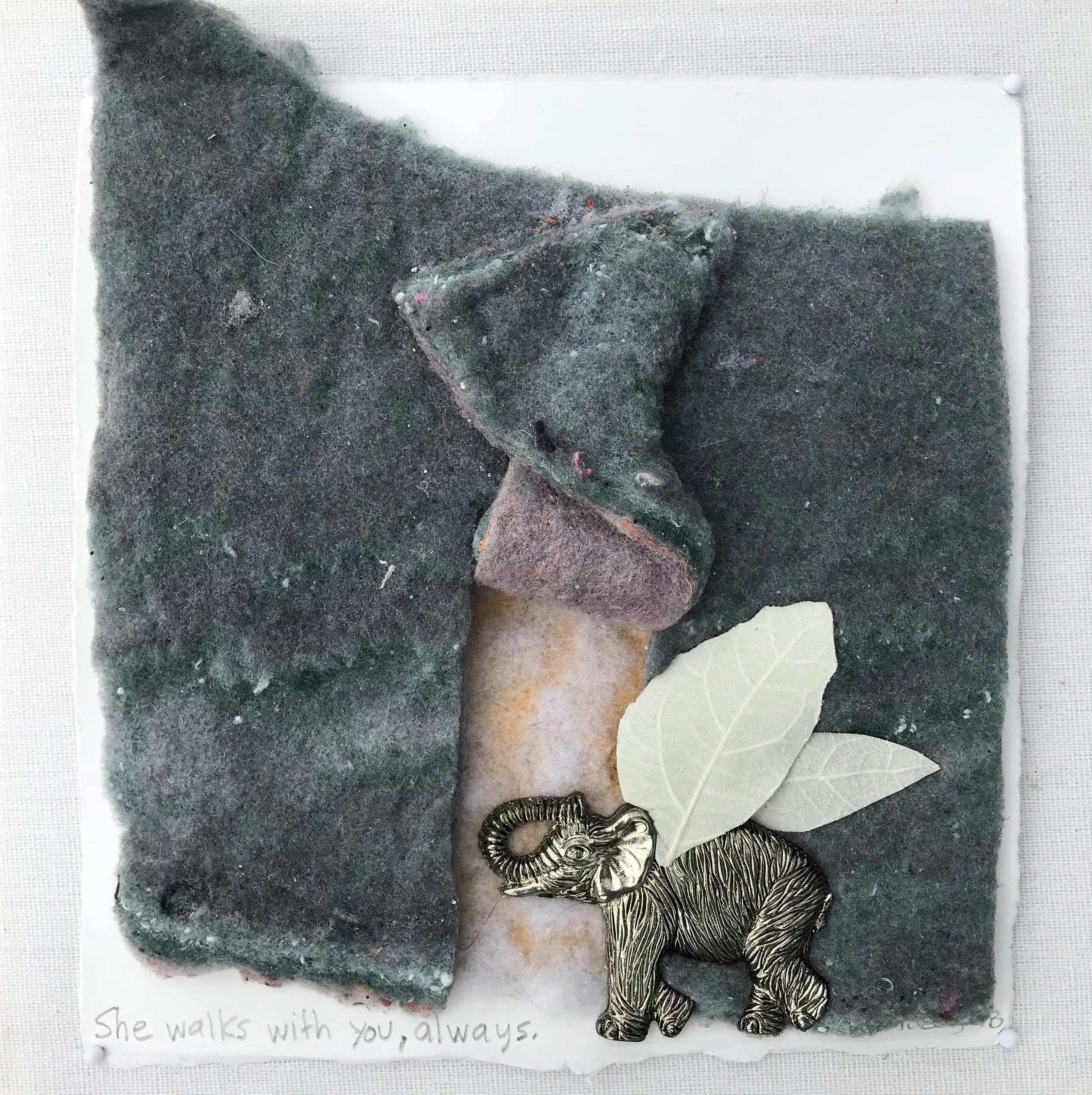 She walks with you, always. - 2018 laundry lint, white poplar leaves, metallic elephant on cotton rag paper
