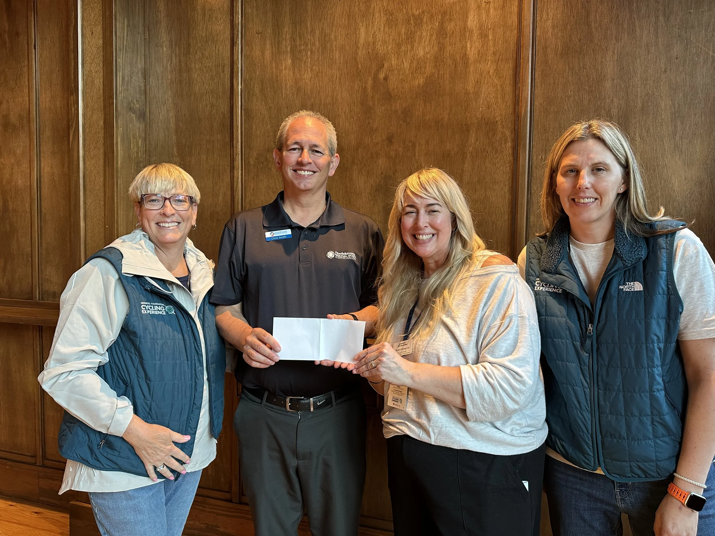  President Chris Smith Presenting The Arthritis Foundation Cycling Team a donation for the CHC 2026. 