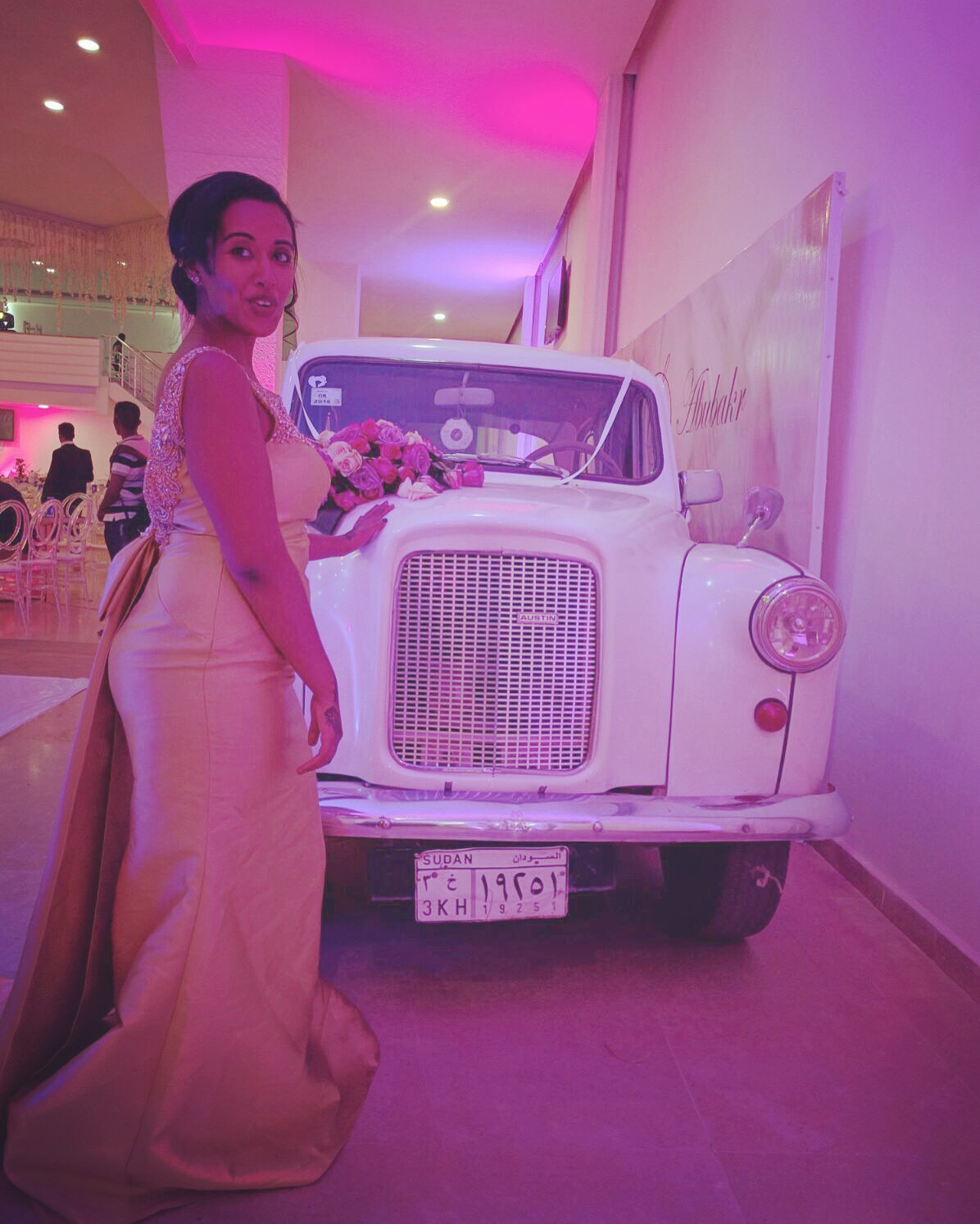 In my ball gown posing next to the vintage Rolls Royce. Shoutout cuzzo for providing the car, the pose, and the awkward smile!