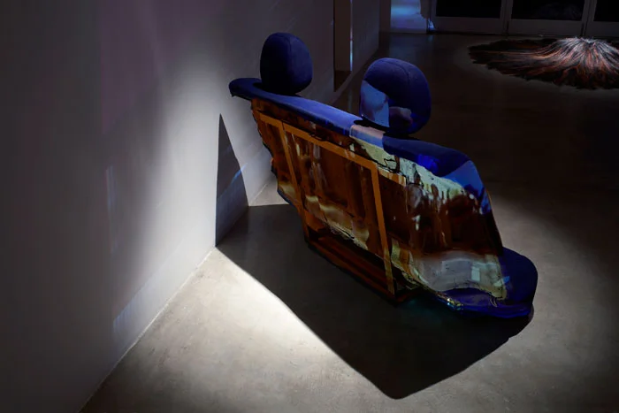 Curtis Mitchell, Pulp Fiction (detsil), 2009, video installation, hair (pillow), car seat, dimensions variable