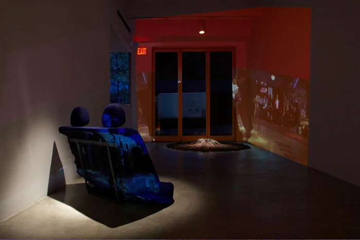 Curtis Mitchell, Pulp Fiction, 2009, video installation, hair (pillow), car seat, dimensions variable