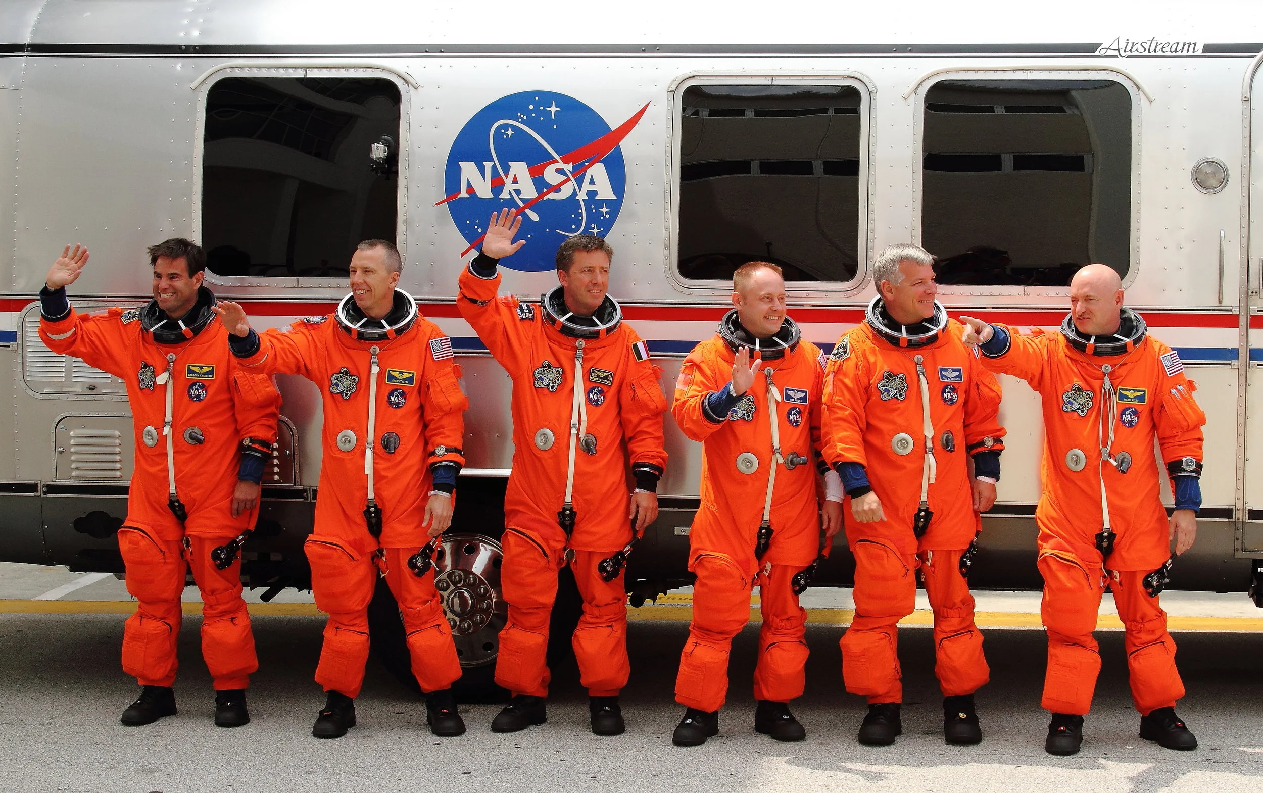 The Crew of STS 134 posing in front of the Astro Van before heading to the Launch Pad. Mission Specialists Gregory Chamitoff, Andrew Feustel, Roberto Vittory, Michael Fincke, Pilot Gregory Johnson and Commander Mark Kelly