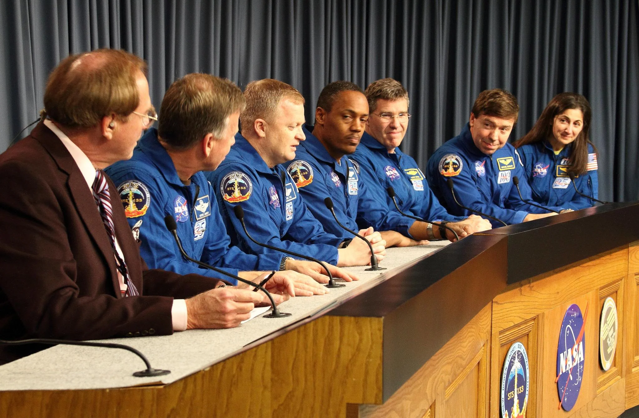 March 9, 2011. The crew of Space Shuttle Discovery (Steven Lindsey, Eric Boe, Nicole Stott, Alvin Drew, Michael Barratt and Stephen Bowen) talk to the media at the Press Site of the Kennedy Space Center just hours after landing from their STS-133 mission.