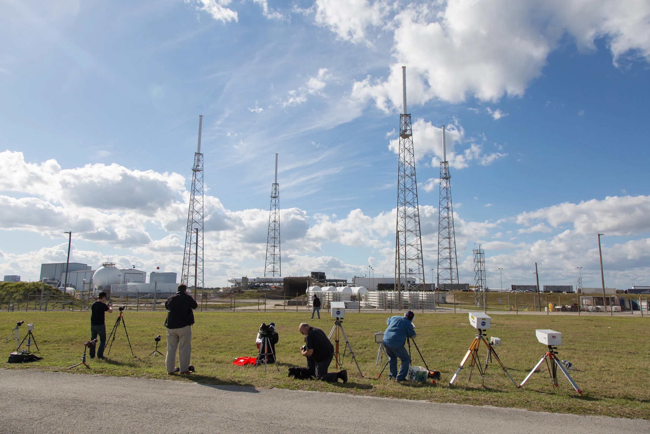 January 12, 2018. While a SpaceX’s Falcon 9 and a Dragon capsule on top remain horizontal at Launch Complex SLC-40 at the Kennedy Space Center, photographers from different media set up their remote cameras in preparation for launch.