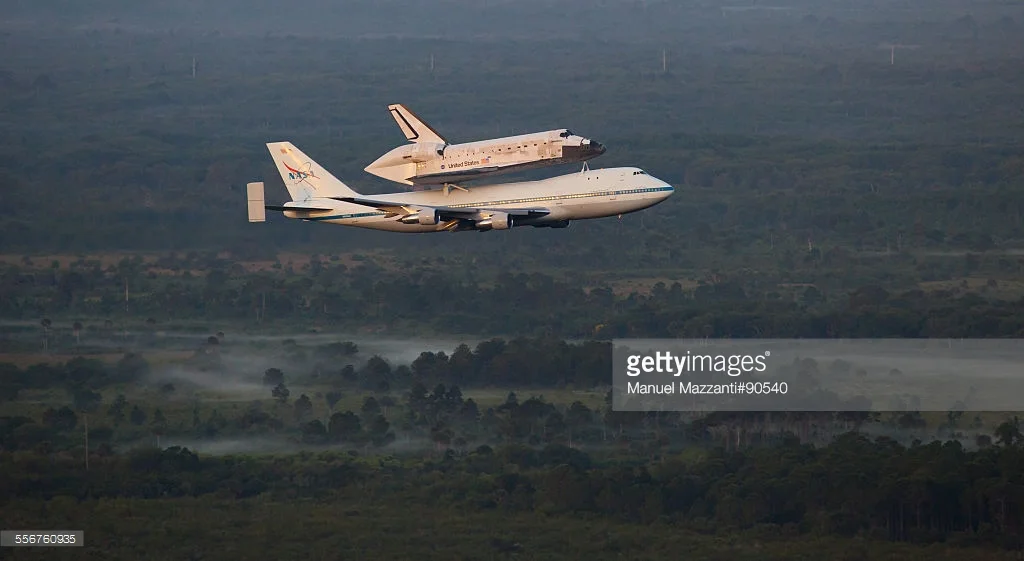 Space Shuttle Discovery on top of the SAC (Shuttle Aircraft Carrier - a modified Boeing 747) leaving Kennedy Space Center to its final destination in Washington DC, the Smithsonian Museum.