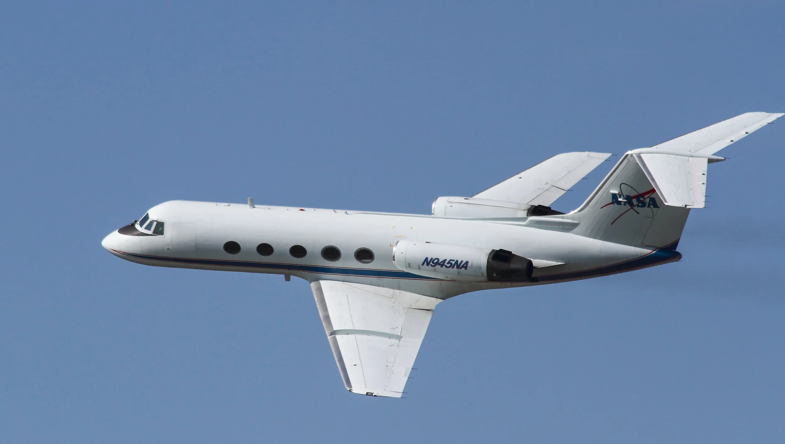 March 9, 2011. The Shuttle Training Aircraft (STA), a NASA modified GulfStream plane used by astronauts to simulate shuttle landings, flies over the Shuttle Landing Facility to check the weather and wind conditions before Space Shuttle Discovery’s final approach and landing (STS-133).