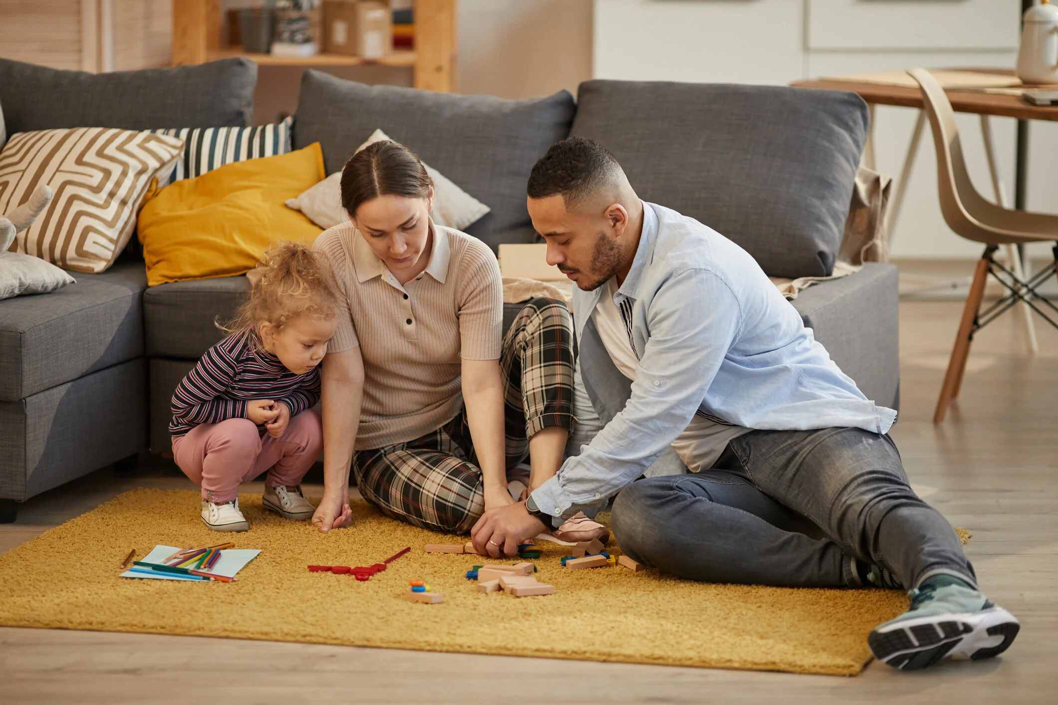 Family Playing with Little Child at Home - iStock-1196980278.jpg