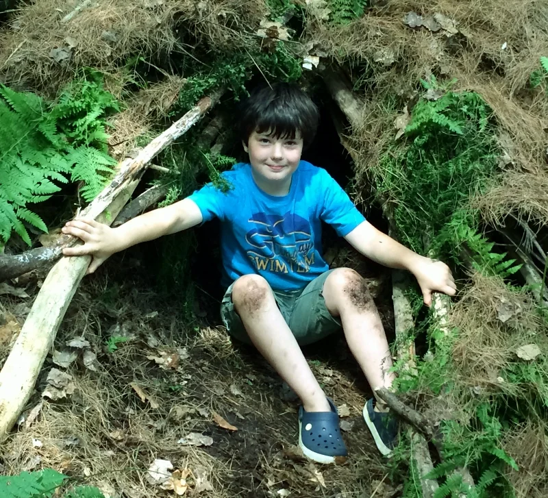 one of the proud engineers of a wilderness shelter at summer camp 2015.