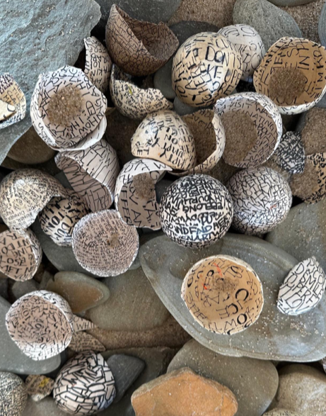 Art by CONNIE SAEMS, "Letters To My Beloved", egg shells, newsprint, ink, installation size 26” x 20” x 4”, $50/shell, $60/shell with gold leaf, Poetry by WENDY DREXLER