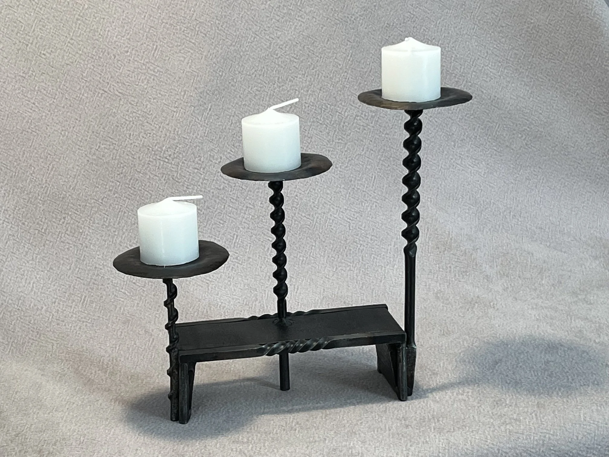 "Drill Bit Votive Candle Holder" with C channel base, steel, 10" x 4.5" x 9.5" (with candle), $110 