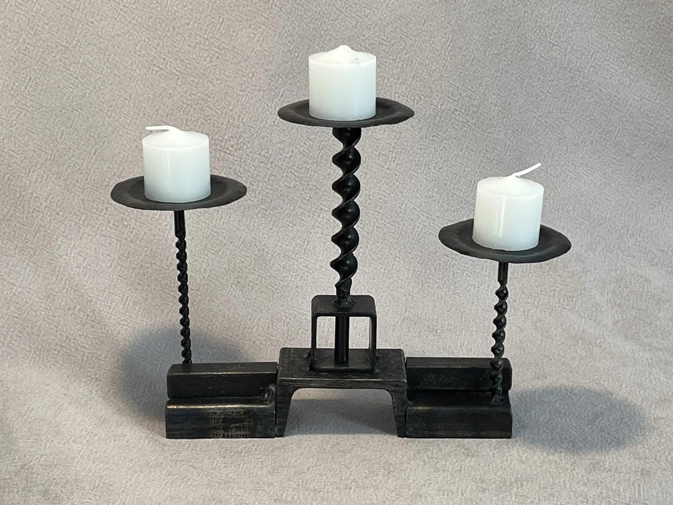 "Drill Bit Votive Candle Holder" with stacked base, steel, 10.5" x 3.5" x 8.75" (including candle), $110