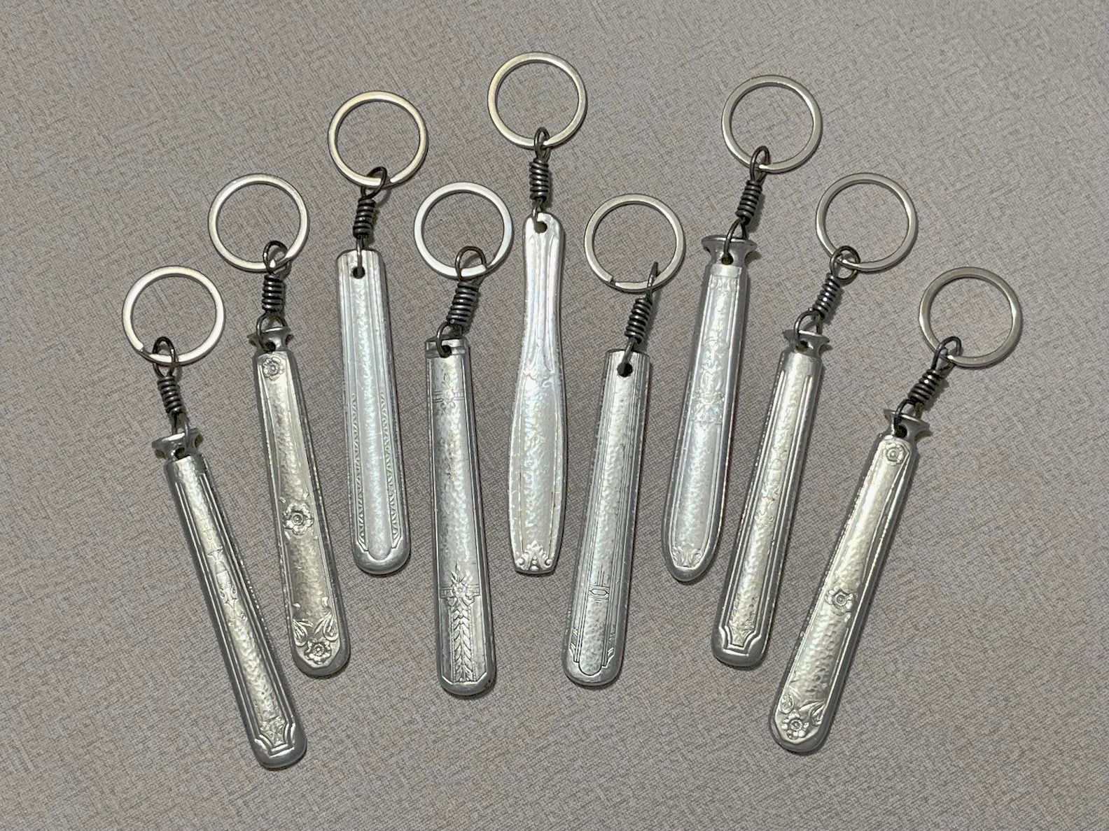 "Antique Knife Handle Key Chains", silver plated metal, approx 6" long, $25 each