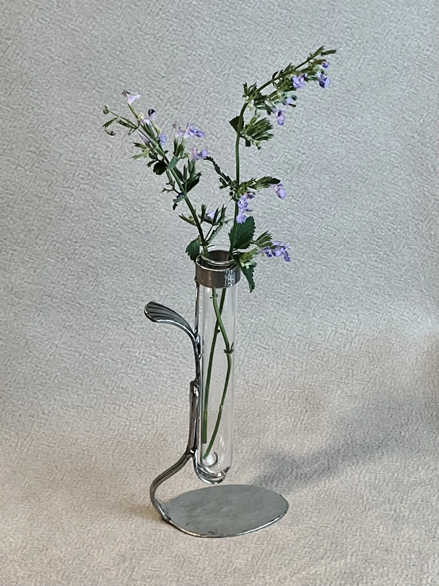"Propagation Vase II", test tube, silverware, metal, 2" x 3.5" x 7", $50