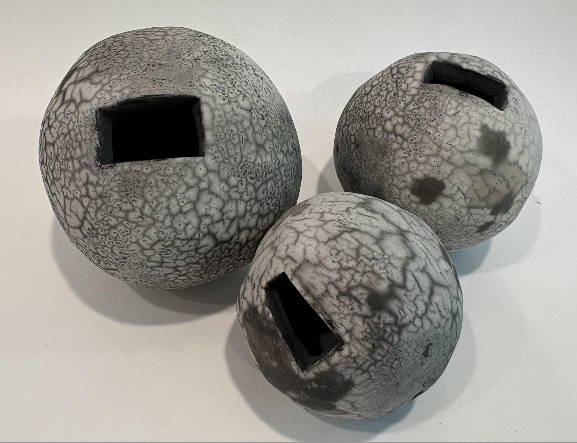 "Triplets", naked raku, 4" x 4" x 4", 3.5" x 3.5" x 2", 3" x 3" x 3", $60