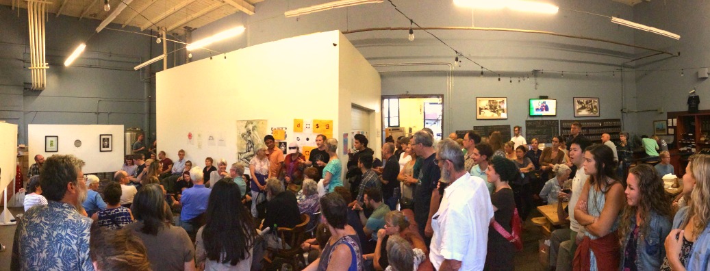 The brewer at Machine House Brewery in Seattle talks to the audience about his English-style ales