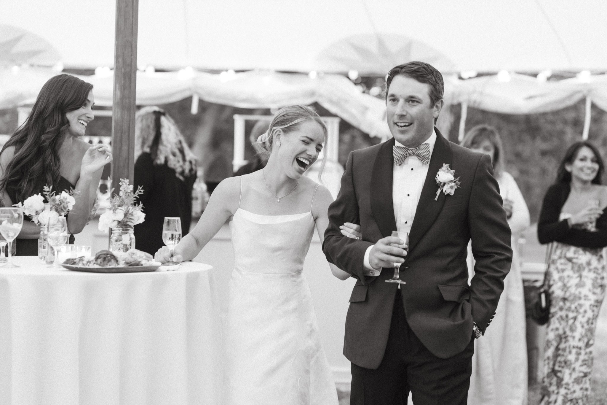 Bride and Groom laughing during toasts at their Martha's Vineyard wedding