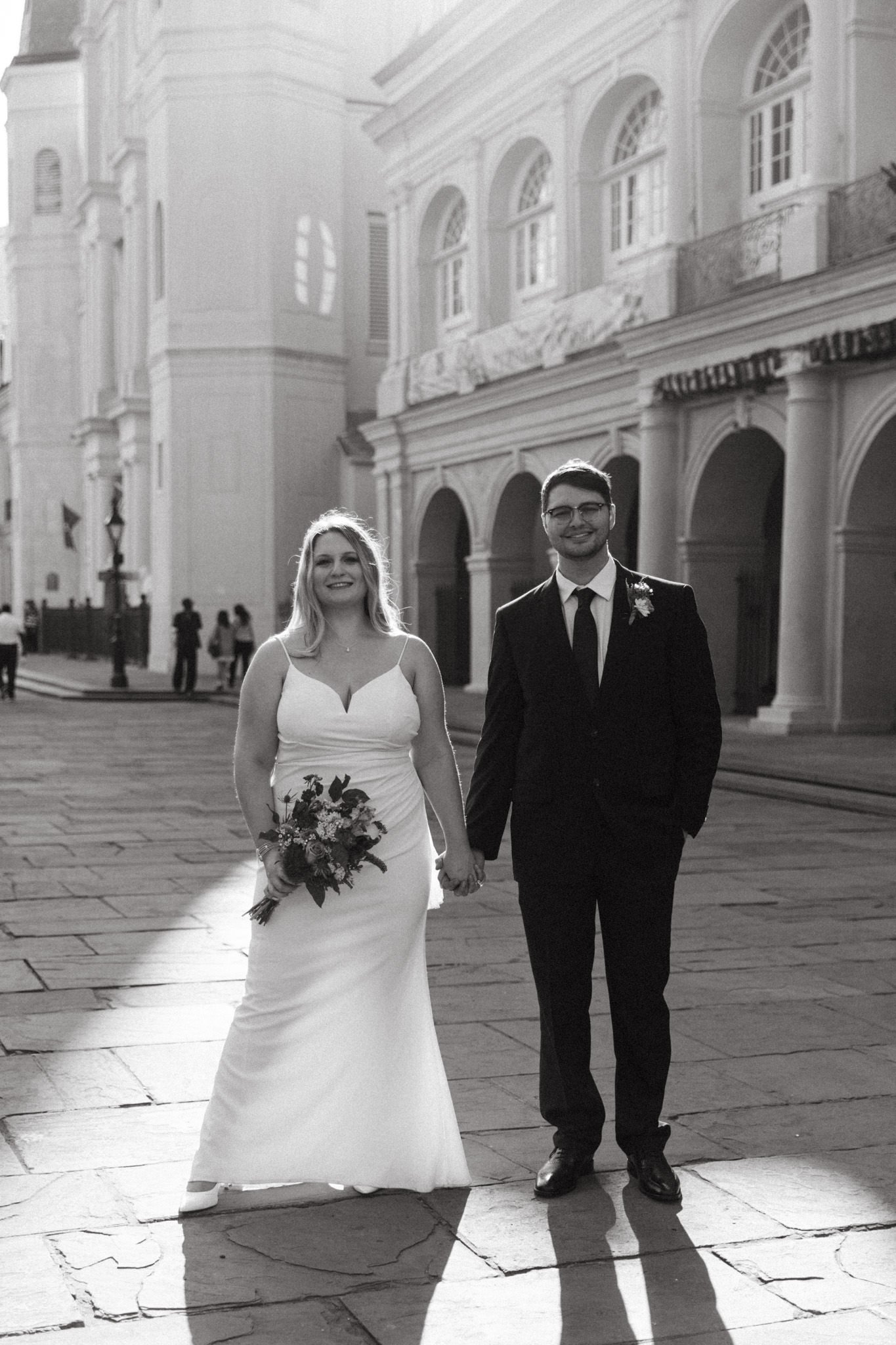 Bride and Groom smiling in Jackson Square after they eloped