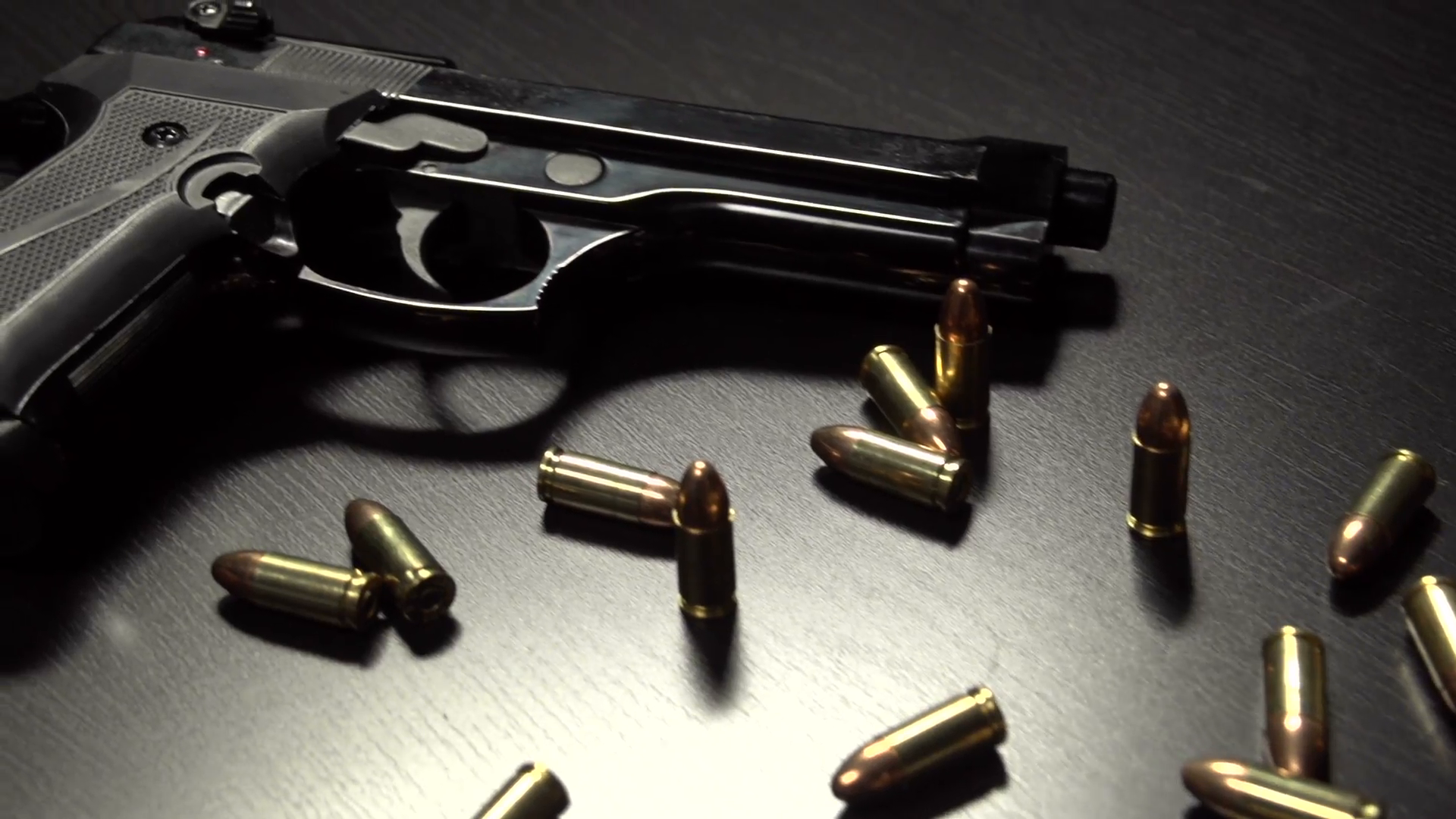bullets-and-guns-on-a-table-dolly-shot_ejbnde7n__F0006.png