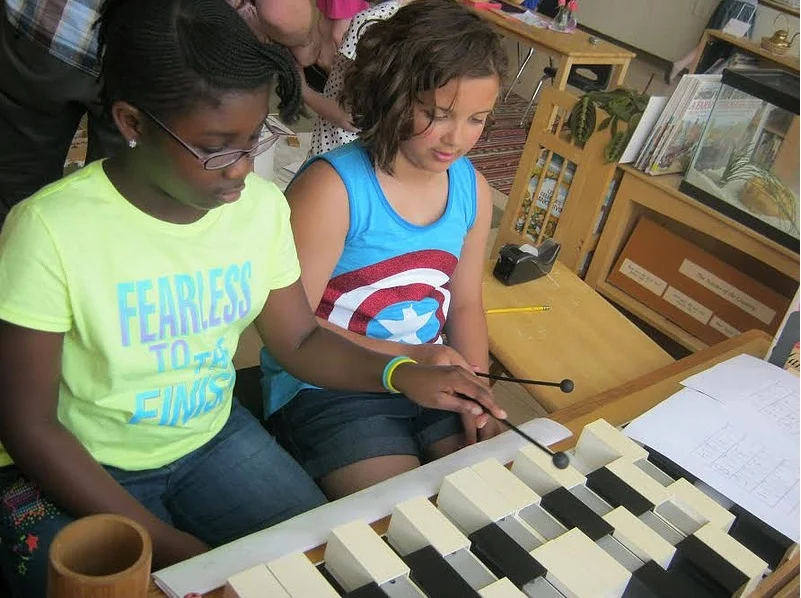 Children composing melodies on Music Grid Paper&nbsp;using the tone bars.